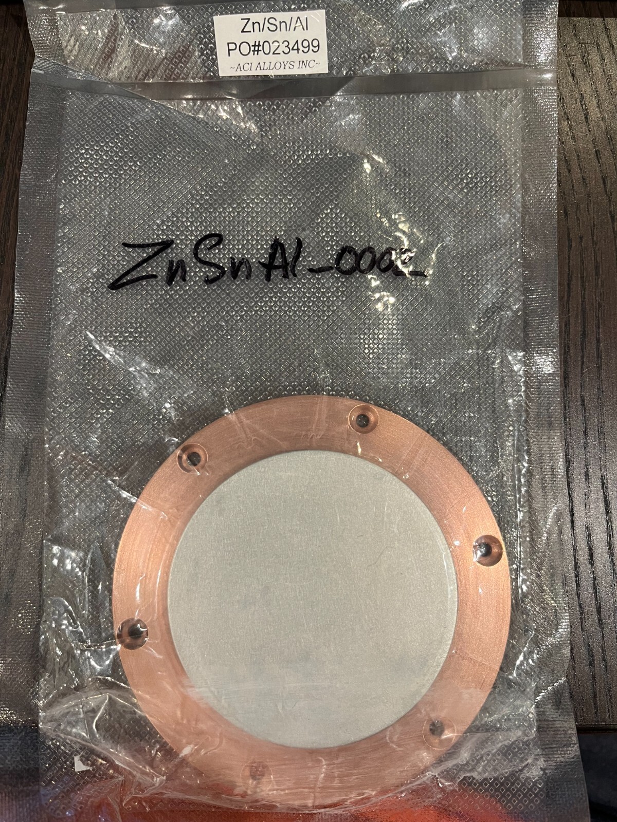 Sputtering Target, ZnSnAl, approximately 3″ x .250″ w/ 4″copper backing plate